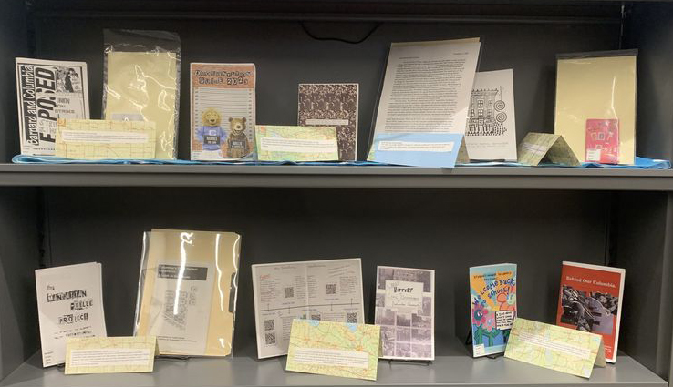 photo of two shelves of zines, titles in the blog post