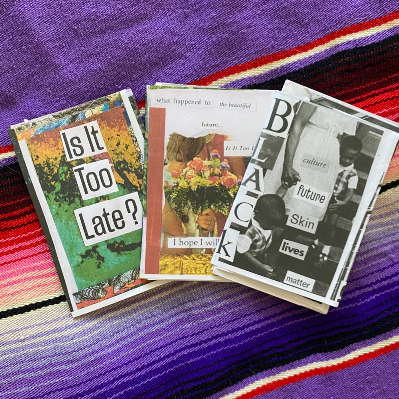 Hauwa's three zines on a serape