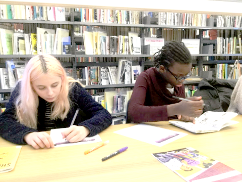 photo of two Blue School students in the Barnard Zine Library