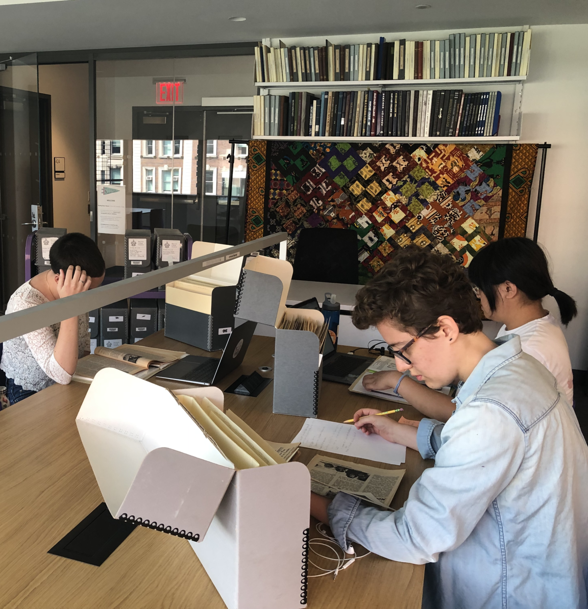 photo of Barnard Archives and Special Collections Reading Room with researchers working at a table